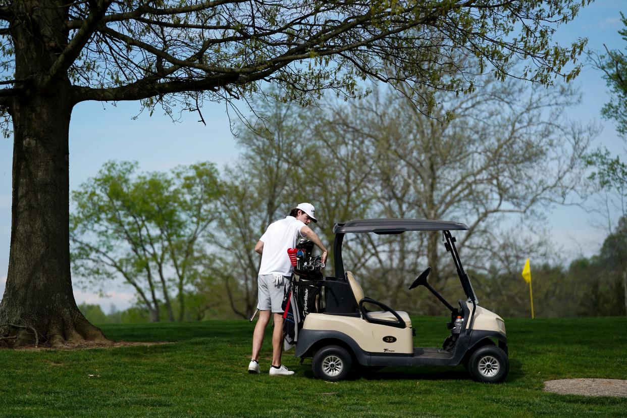 A golfer selects his clubs of choice before playing a shot at California Golf Course, Tuesday, April 16, 2024, in Cincinnati. The high-profile Cincinnati Futures Commission tasked with charting the future for Cincinnati's leaders recommended the city regionalize its water system, write more parking tickets, turn two parks over to the county, lease out Lunken Airport and sell its public golf courses.