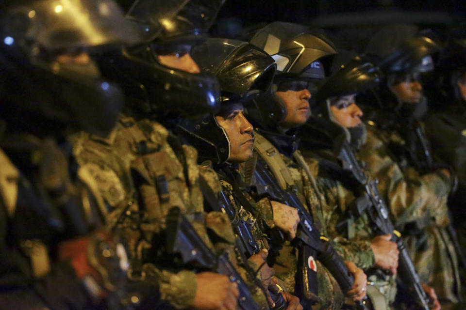 Soldiers line up before leaving to patrol the streets in Bogota, Colombia, Saturday, Nov. 23, 2019. Authorities in Colombia are maintaining a heightened police and military presence in the nation's capital following two days of unrest. (AP Photo/Ivan Valencia)