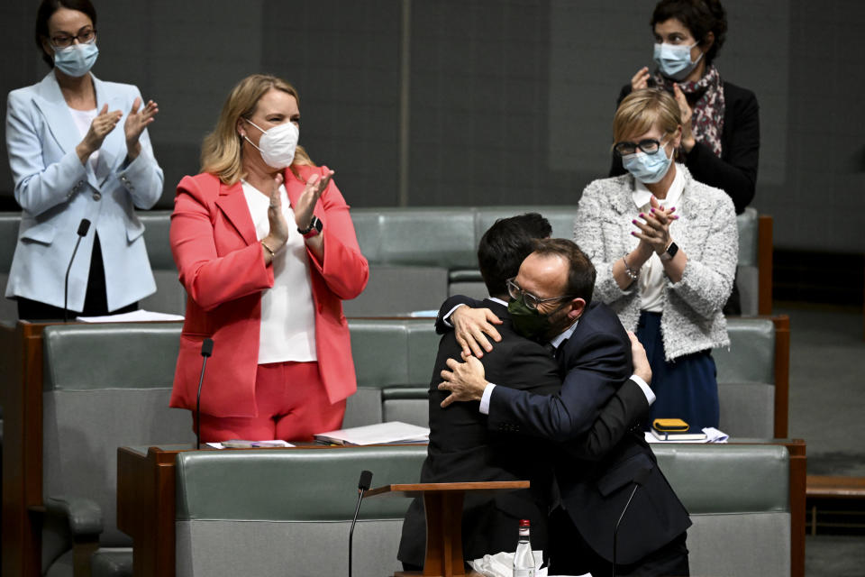 Australian Greens MP for the seat of Brisbane Stephen Bates is congratulated by Australian Greens leader Adam Bandt while receiving a standing ovation. Source: AAP