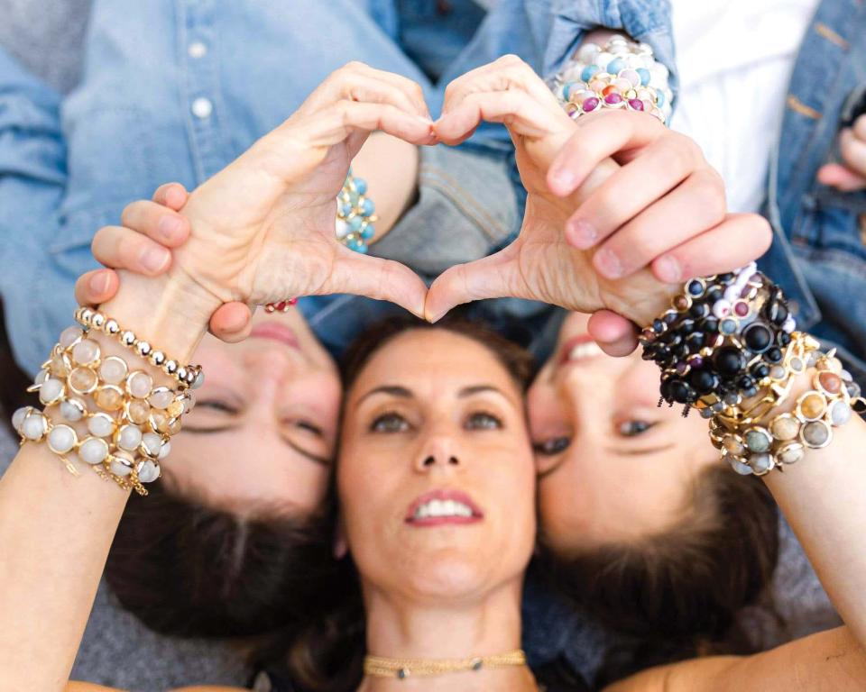 Jewelry designer, Brett Lauren Krugman and owner of Brett Lauren jewelry with her two neices shows off some her pieces