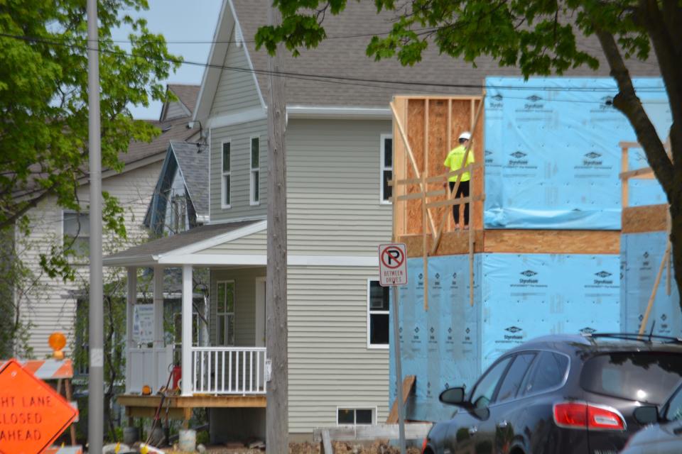 Crews build a new Habitat for Humanity home adjacent to an earlier home on White Rock Avenue Waukesha in 2018. Habitat Waukesha is focusing its efforts on a three-year, 18-home plan for property on the old Aeroshade factory land on Oakland Avenue, an effort even larger than its 13 homes on White Rock.