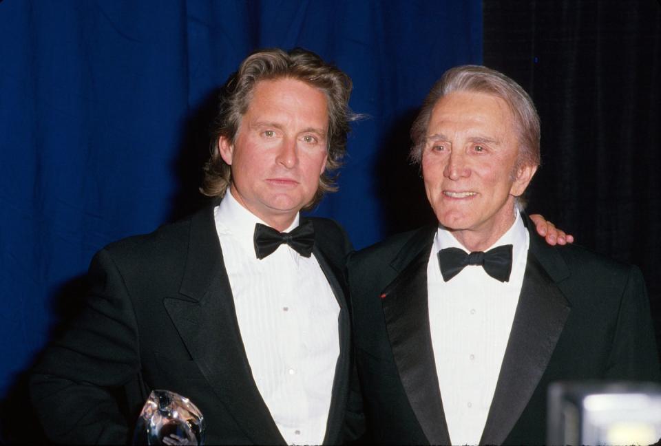 <p>Kirk poses with his son Michael, who followed in his father's footsteps into acting.</p>