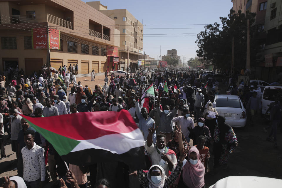 People march during a protest to denounce the October military coup, in Khartoum, Sudan, Thursday, Dec. 30, 2021. The October military takeover upended a fragile planned transition to democratic rule and led to relentless street demonstrations across Sudan. (AP Photo/Marwan Ali)