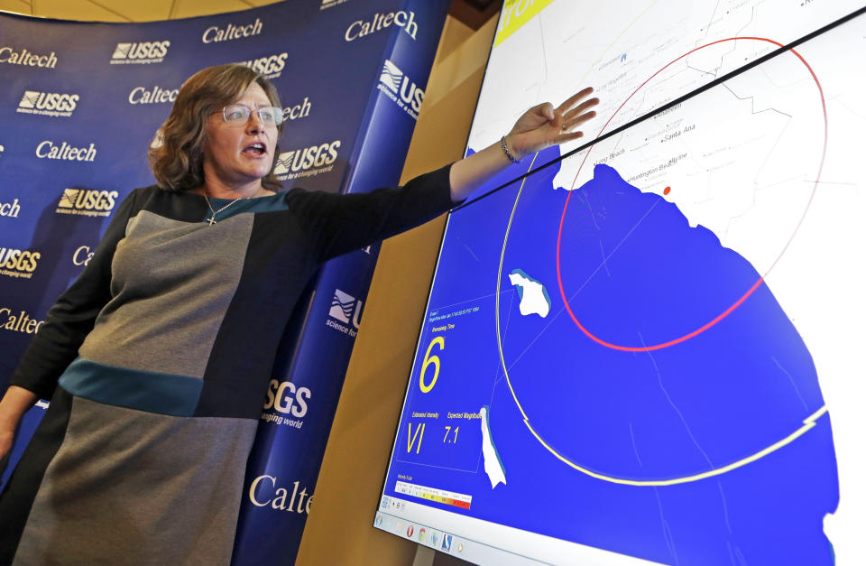 FILE - Dr. Lucy Jones, senior advisor for risk reduction for the U.S. Geological Survey, describes how an early warning system would provide advance warning of an earthquake, at a news conference in the Seismological Laboratory at the California Institute of Technology in Pasadena, Calif., on Jan. 28, 2014. Seconds before a magnitude 6.4 earthquake jolted the Northern California coast, an alert sent by phone warned 3 million people to "Drop, cover, hold on." The event marked the greatest test yet to an earthquake warning system launched three years ago. (AP Photo/Reed Saxon, File)