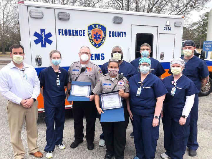 Phonesia Machado-Fore is shown in the center of this Facebook photo posted by the Florence County EMS in February 2021.