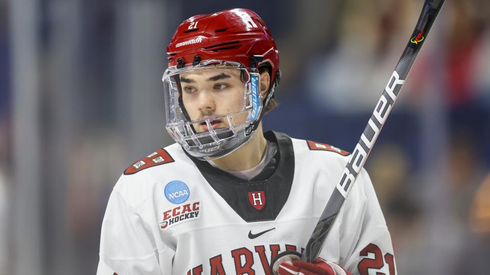 Harvard University forward Sean Farrell (21) reacts during the first period of an NCAA hockey game against Ohio State on Friday, March 24, 2023, in Bridgeport, Conn. (AP Photo/Greg M. Cooper)