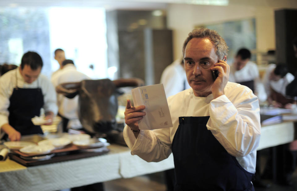 FILE - In this March 30, 2011 file photo, Spanish chef Ferran Adria speaks on the phone in his restaurant elBulli in Roses, Spain. Spanish chef Ferran Adria, the man behind the late, lamented elBulli restaurant, is bringing an exhibition dedicated to the art and science of his experimental brand of cooking to London. The show, which was visited by 650,000 people during a year-long run in Barcelona, will be on display from July 5 to Sept. 29, 2013 at London's Somerset House. (AP Photo/Manu Fernandez, File)