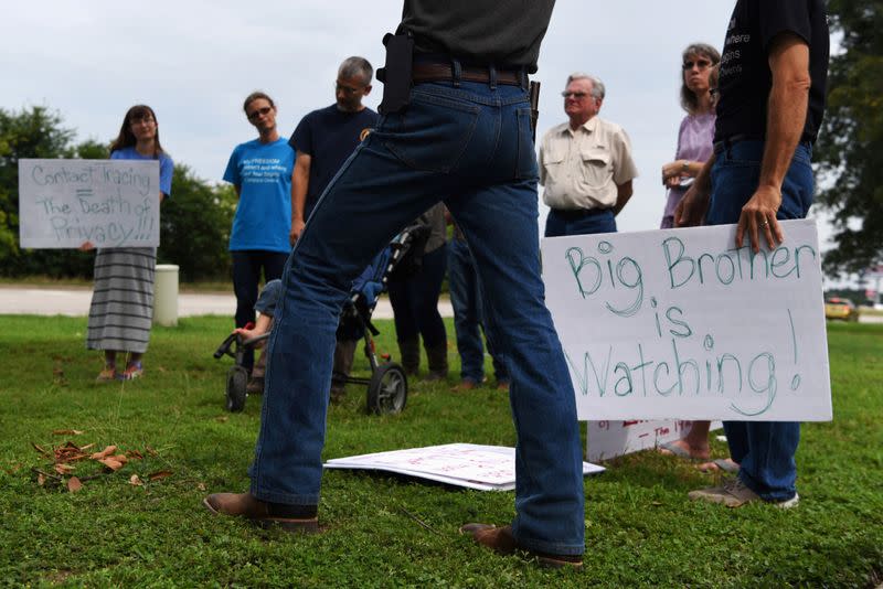 FILE PHOTO: Protesters gather against contact tracing in Conroe, Texas