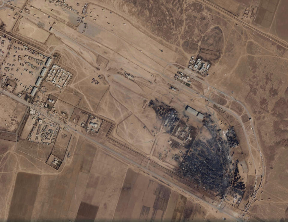 A satellite photo from Planet Labs Inc. shows the aftermath of a massive fire at Islam Qala border crossing in Afghanistan's Herat province on Tuesday, Feb. 16, 2021. The satellite photos analyzed Tuesday by The Associated Press show the devastation after a series of explosions and fires consumed hundreds of fuel tankers on the Afghan-Iranian border on Saturday, Feb. 13, 2021. (Planet Labs Inc. via AP)