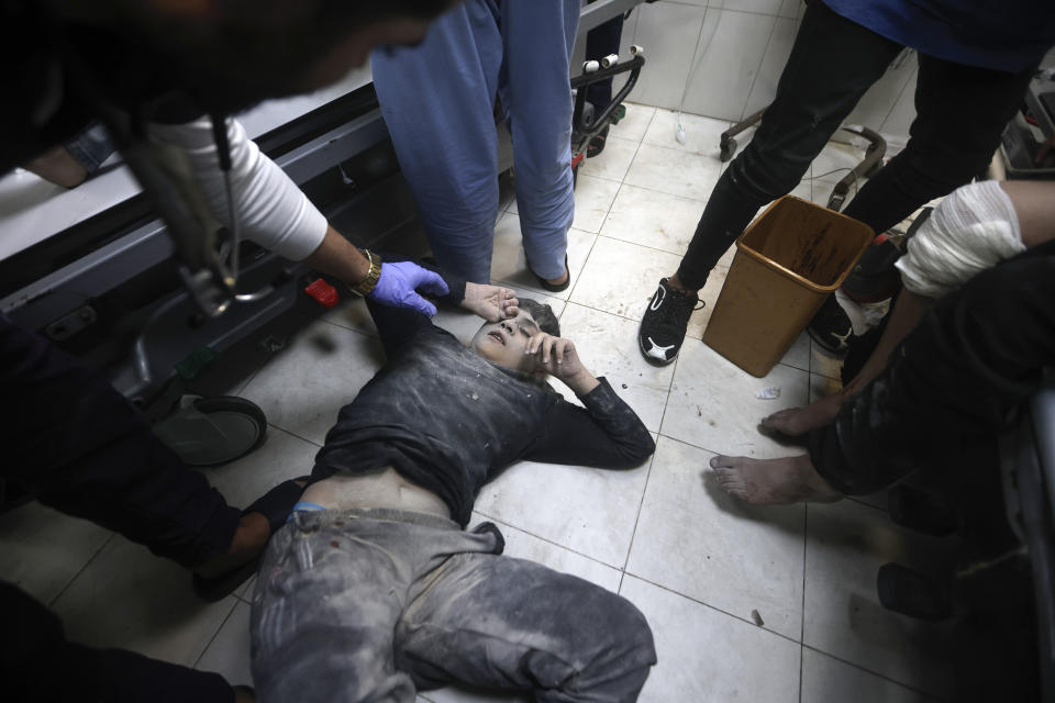 Palestinians wounded in Israeli bombardment, receive treatment at the hospital in Khan Younis refugee camp, southern Gaza Strip, Thursday, Jan. 11, 2024. (AP Photo/Mohammed Dahman)