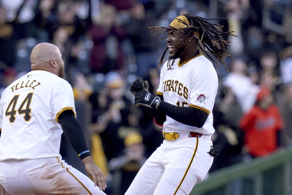 Pittsburgh Pirates' Oneil Cruz, right, celebrates with Rowdy Tellez, left, after hitting a walkoff single during the 11th inning of a baseball game against the Baltimore Orioles, Saturday, April 6, 2024, in Pittsburgh. (AP Photo/Matt Freed)