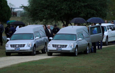 Hearses carrying Richard and Therese Rodriguez arrive at the cemetery after the husband and wife were killed in the shooting at First Baptist Church of Sutherland Springs in Texas, U.S., November 11, 2017. REUTERS/Rick Wilking