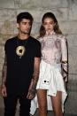 <p>Zayn Malik: 5' 9"<br>Gigi Hadid: 5' 10"</p>