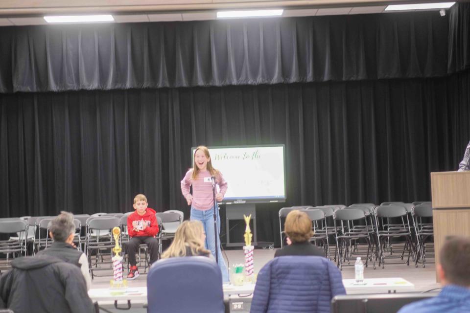 Lily McClenny reacts to winning the Randall County Junior Spelling Bee Monday at Heritage Hills Elementary in Amarillo.