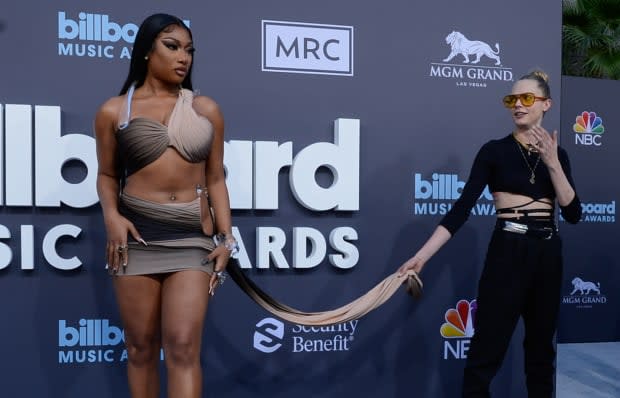 LAS VEGAS, NEVADA - MAY 15: Megan Thee Stallion (L) and Cara Delevingne attend the 2022 Billboard Music Awards at MGM Grand Garden Arena on May 15, 2022 in Las Vegas, Nevada. (Photo by Mindy Small/FilmMagic)<p><a href="https://www.gettyimages.com/detail/1397538416" rel="nofollow noopener" target="_blank" data-ylk="slk:Mindy Small/Getty Images;elm:context_link;itc:0;sec:content-canvas" class="link ">Mindy Small/Getty Images</a></p>