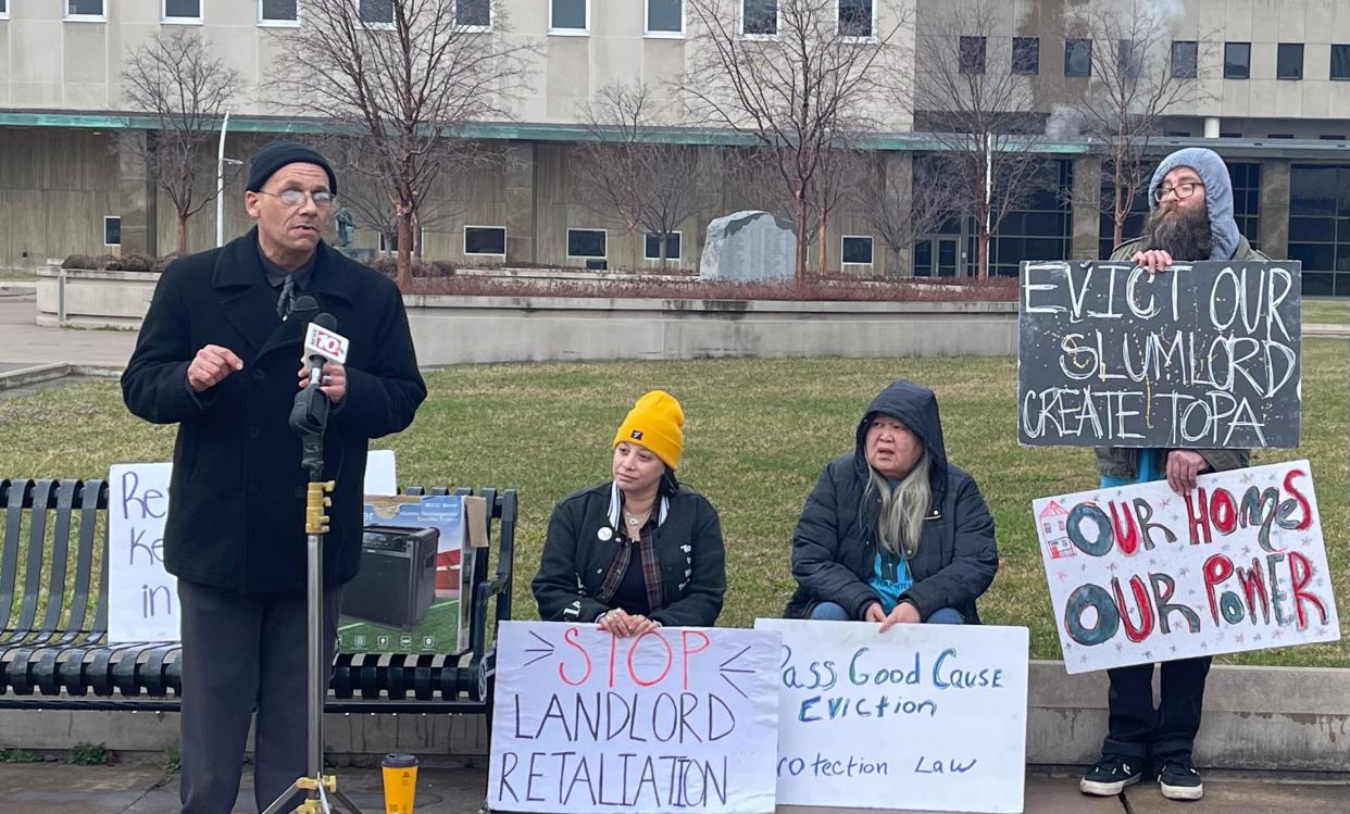 Oscar Brewer and supporters gather Tuesday outside of Monroe County Hall of Justice prior to his appearance in eviction court.