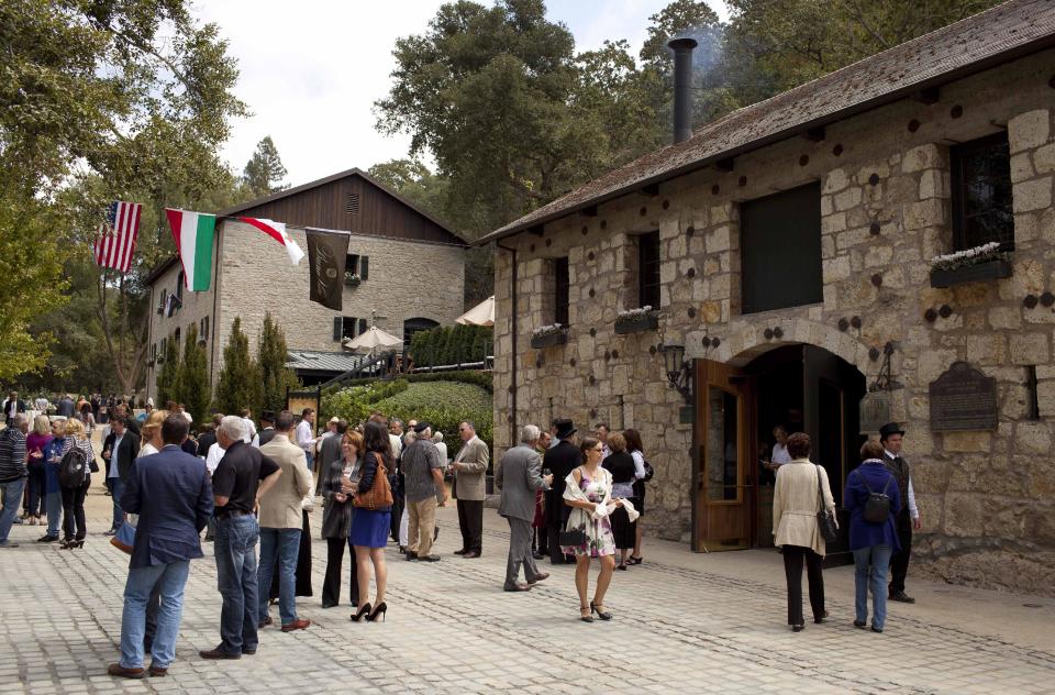 In this photo taken Friday, Aug. 31, 2012 people attend a celebration of the re-birth of Buena Vista Winery's historic champagne cellars and caves at the winery in Sonoma, Calif. Many people think the California wine world came of age in 1976 after a famous tasting in Paris put the Golden State’s vintages on the world map. But for Jean Charles Boisset, new owner of the state’s oldest commercial winery, the state’s fine wine making traditions started a century before that. That’s why the Burgundian is building the future of 155-year-old Buena Vista Winery, a landmark known as the birthplace of California wine, on its past. He plans to make wines in September in the stately stone buildings and old wine caves for the first time in two decades. (AP Photo/Eric Risberg)