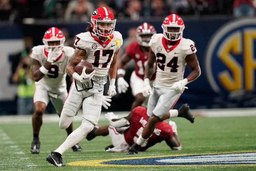 Georgia wide receiver Anthony Evans III (17) runs the ball during the second half of the Southeastern Conference championship NCAA college football game against Alabama in Atlanta, Saturday, Dec. 2, 2023. (AP Photo/Mike Stewart)