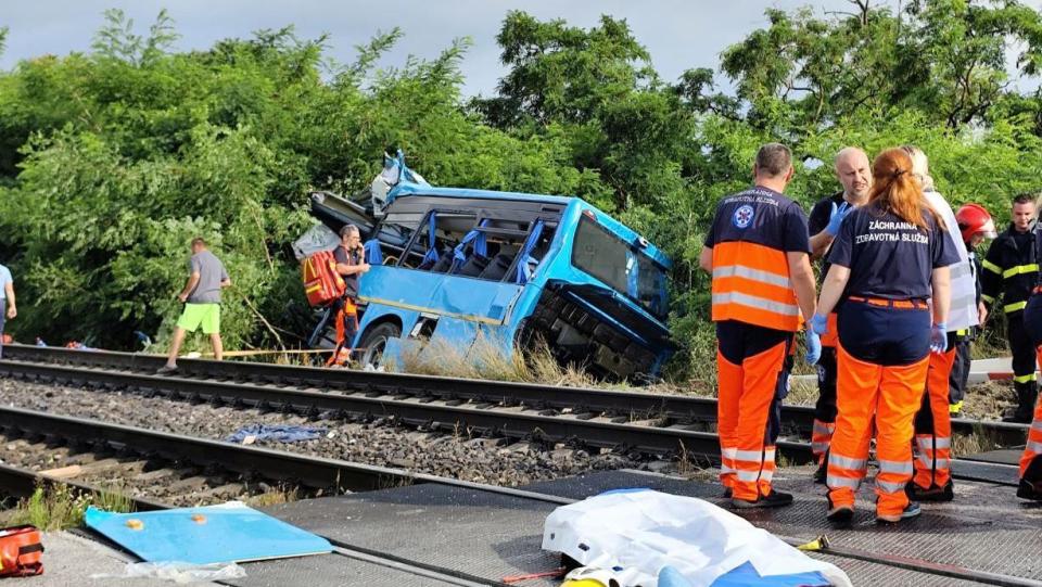 Emergency personnel work at the site of the collision