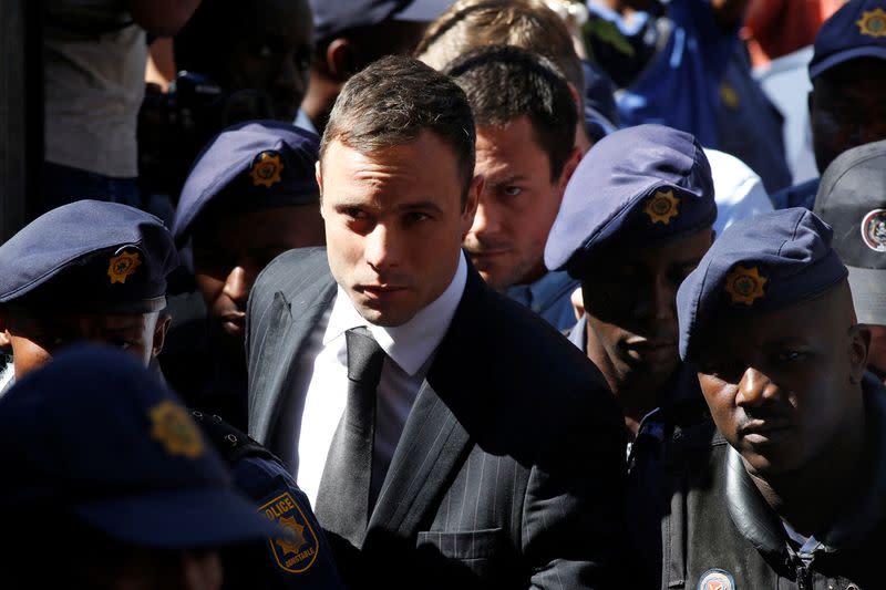 FILE PHOTO: South African Olympic and Paralympic sprinter Pistorius arrives at the North Gauteng High Court in Pretoria