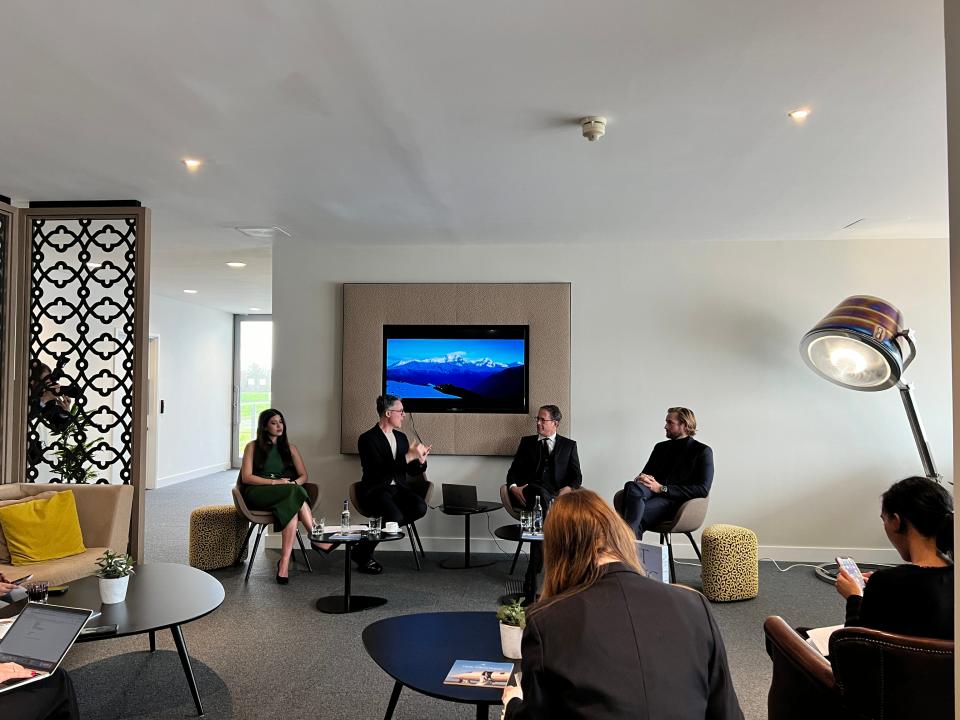 Four people sit on a panel at a lounge in Farnborough Airport