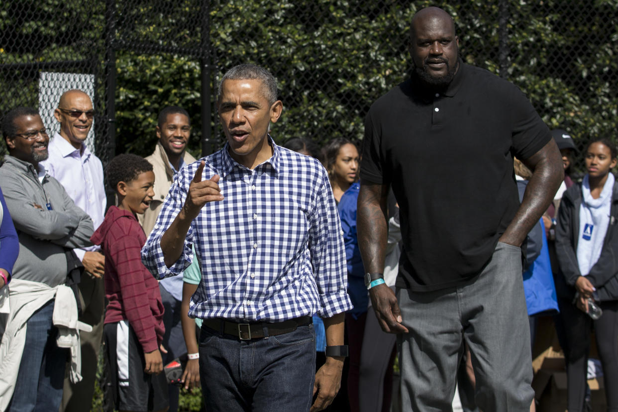 WASHINGTON, DC - MARCH 28: President Barack Obama and former NBA player Shaquille O'Neal walk together on the basketball court  during the annual White House Easter Egg Roll on the South Lawn of the White House March 28, 2016 in Washington, DC. The tradition dates back to 1878 when President Rutherford B. Hayes allowed children to roll eggs on the South Lawn. (Photo by Drew Angerer/Getty Images)