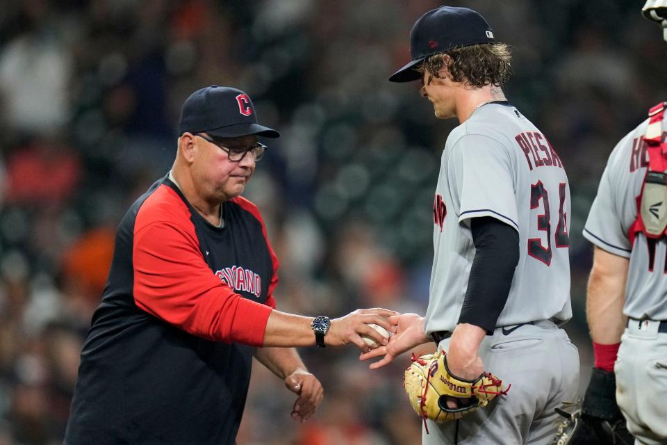 Guardians starting pitcher Zach Plesac, right, is removed from the game by manager Terry Francona during the fifth inning of a 7-3 loss to the Houston Astros on Tuesday night. [Eric Christian Smith/Associated Press]