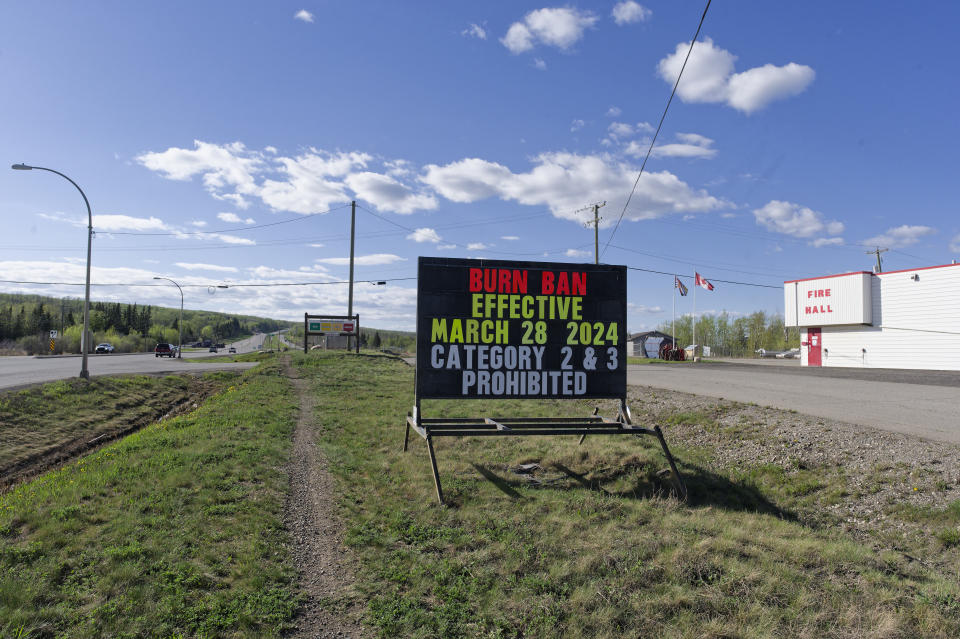 <p>An extreme fire warning sign is shown along Highway 97 toward Fort Nelson outside the Charlie Lake Fire Hall near Fort St. John, B.C., on Monday, May 13, 2024. Wildfires are forcing more people to evacuate their homes in dry and windy northeastern B.C.</p> 