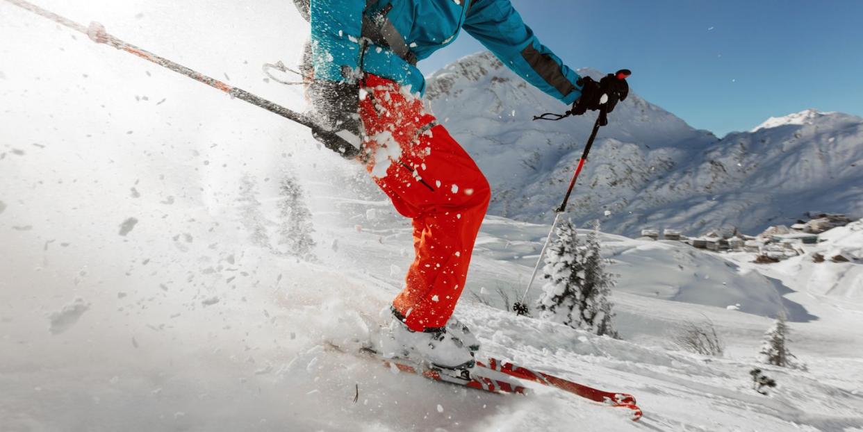 person downhill skiing on mountain