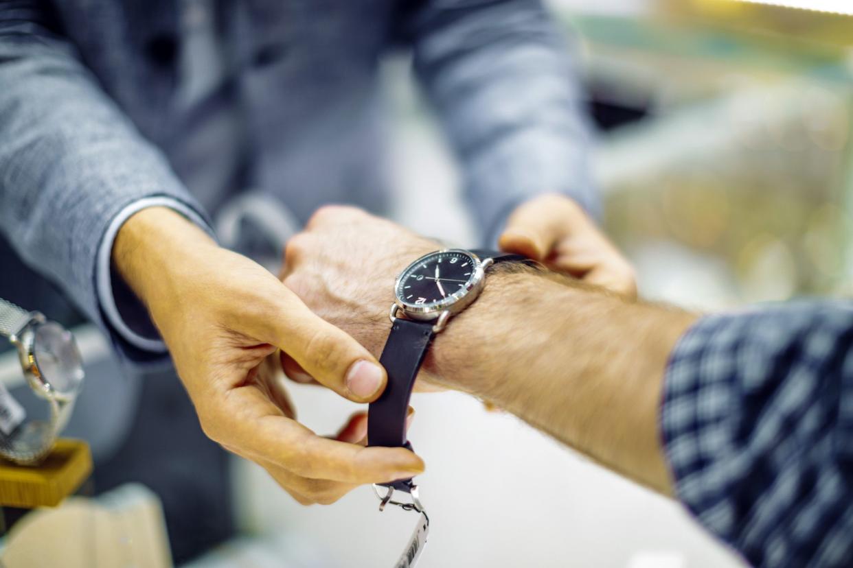 man trying on watch