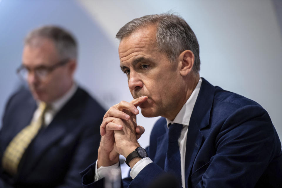 Governor of the Bank of England, Mark Carney pauses during the Bank of England interest rate decision and inflation report press conference at the Bank of England in London,  Thursday, Aug. 1, 2019. Brexit uncertainties are becoming "more entrenched" and increasingly weighing on the British economy less than three months before the country is scheduled to leave the European Union, the Bank of England said Thursday.(Chris J Ratcliffe/Pool Photo via AP)