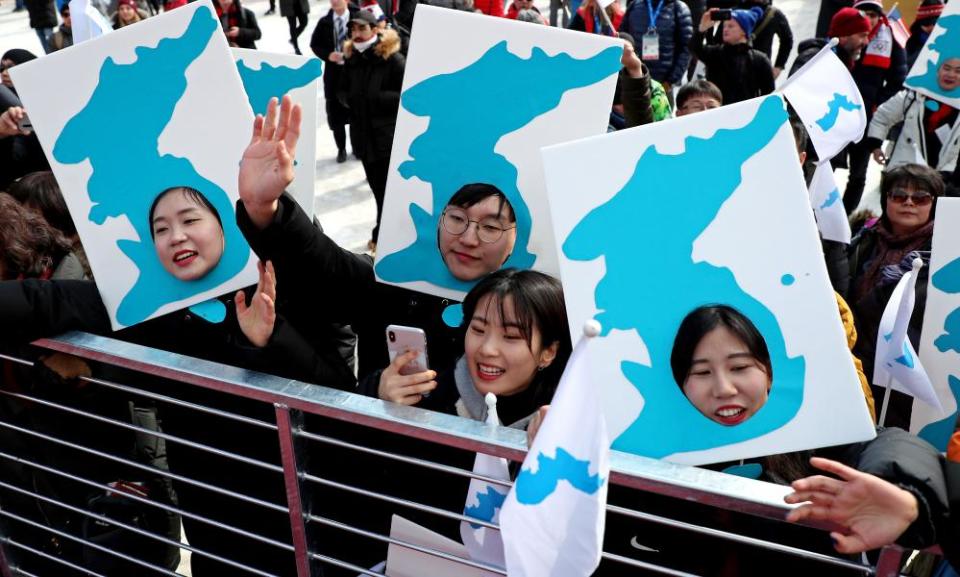 South Koreans cheer for the North Korean cheerleaders at in the men’s giant slalom during the Pyeongchang 2018 Olympic Winter Games