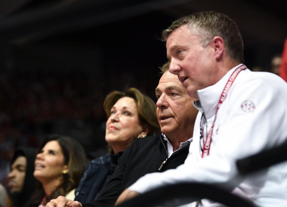 Feb 18, 2023; Tuscaloosa, Alabama, USA; Alabama head football coach Nick Saban and his wife Terry, left, center, sit with Alabama athletics director Greg Byrne as they watch the Crimson Tide play Georgia at Coleman Coliseum. Mandatory Credit: Gary Cosby Jr.-USA TODAY Sports