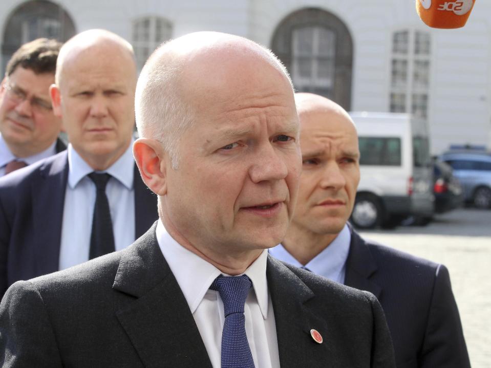 British Foreign Secretary William Hague talks to the press as he arrives for talks at the European Council in Vienna, Austria, Tuesday, May 6, 2014. (AP Photo/Ronald Zak)