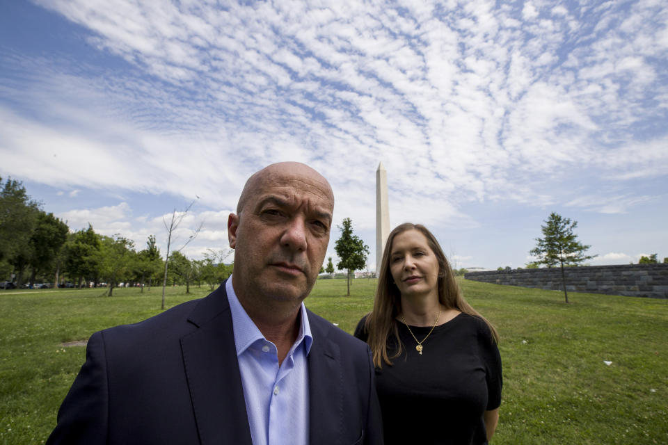 In this June 24, 2019, photo, former Venezuelan police commissioner Ivan Simonovis poses for a photograph with his wife Bony Pertnez in Washington. In his first interview from exile in the U.S., Simonovis, the former police commissioner whose about 15-year detention became an opposition rallying cry, shares details of his movie-like breakout. (AP Photo/Alex Brandon)