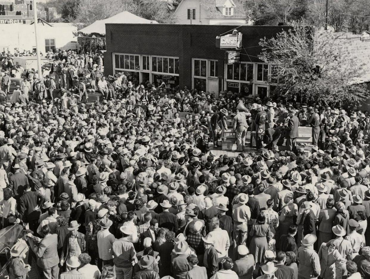 A crowd standing shoulder to shoulder turns its attention to the small stage where the main attraction — a rattlesnake — is being lifted from a cage to be weighed. About 18,000 people swarmed Waynoka on a Sunday in 1953 for the Waynoka Saddle Club's Rattlesnake Hunt. This photo was published April 13, 1953, in the Oklahoma City Times. This year is Waynoka's 77th rattlesnake event, which will be held Friday through Sunday, while events related to the Okeene Rattlesnake Hunt and the Apache Rattlesnake Festival will begin Thursday and continue through Sunday. The Mangum Rattlesnake Derby will be April 28-30.