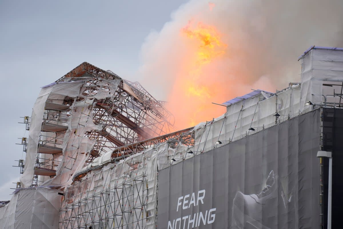 Flames and smoke rise from the old stock exchange in Copenhagen (EPA)