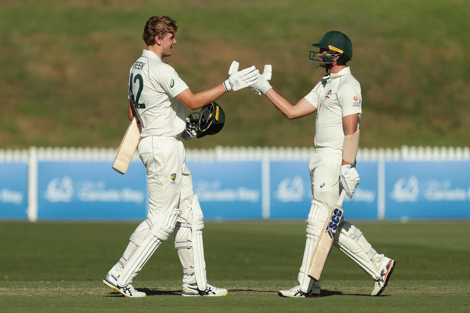 Cameron Green of Australia A celebrates with Mark Steketee of Australia A after hitting a century.