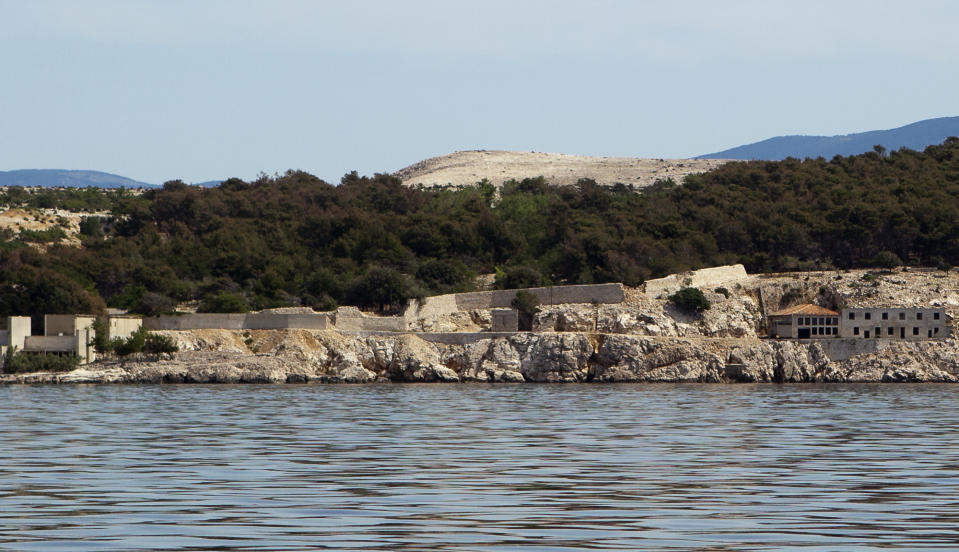 In this photo taken June 28, 2012, the Adriatic island of Goli Otok is seen from the sea. The prison island housed up to 16,000 political prisoners over an eight-year period. They ended up there after being accused by Tito's regime of expressing sympathy toward Josef Stalin and his hardline Soviet dictatorship. (AP Photo/Darko Bandic)