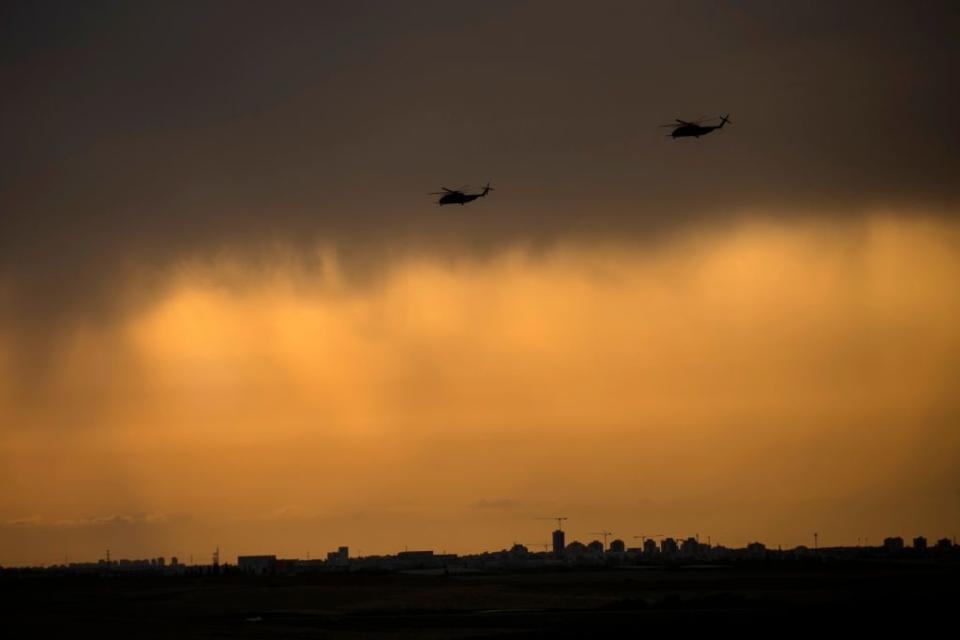 Israeli attack helicopters make their way to the Israeli southern border and the Gaza Strip on Monday.