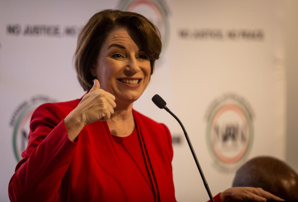 Amy Klobuchar gestures to an audience at a breakfast event on Thursday, Nov. 21, 2019, in Atlanta. Klobuchar, along with Pete Buttigieg, Cory Booker, Andrew Yang and Tom Steyer, all presidential hopefuls, spoke at the event hosted by the Al Sharpton's National Action Network. (AP Photo/ Ron Harris)