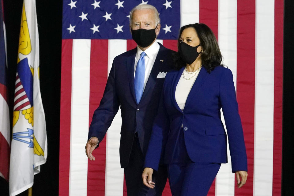 Democratic presidential candidate former Vice President Joe Biden and his running mate Sen. Kamala Harris, D-Calif., arrive to speak at a news conference at Alexis Dupont High School in Wilmington, Del., Wednesday, Aug. 12, 2020. (AP Photo/Carolyn Kaster)