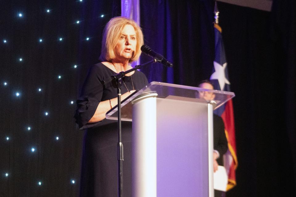 Cari Roach Good talks about her work as she is honored with the 2022 AGN Woman of the Year award at a luncheon Wednesday at the Amarillo Civic Center.