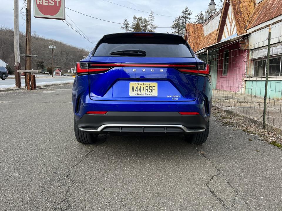 <p>The back of the NX 350 F Sport isn't nearly as memorable, but a singular light bar and thin taillights make the car look handsome and modern. The splash of silver on the lower portion of the bumper is a nice touch. And while the rear wiper isn't as visually appealing, we're glad it's there.</p>