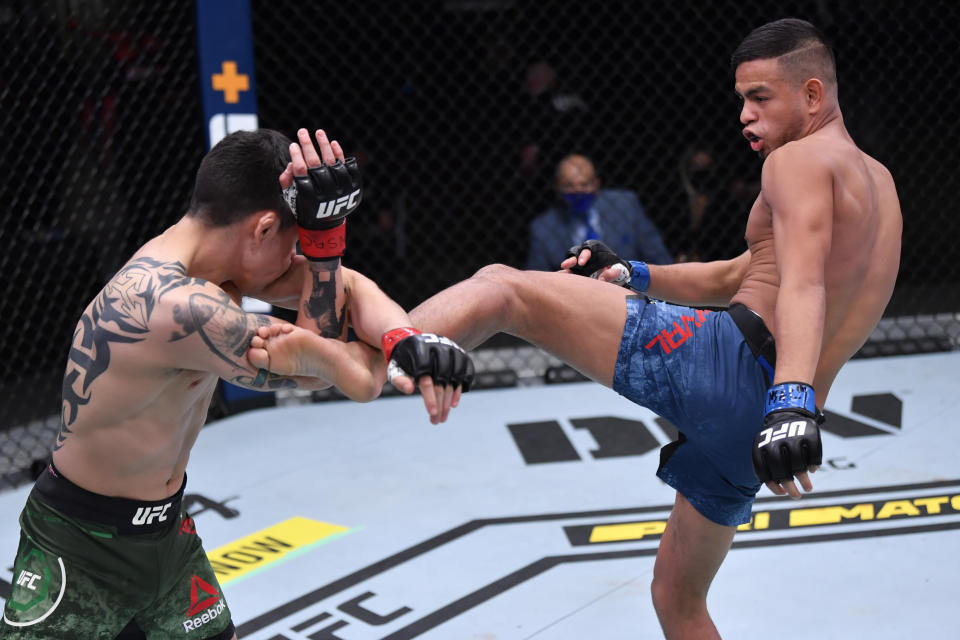 LAS VEGAS, NV – NOVEMBER 21: (R-L) Brandon Royval kicks Brandon Moreno of Mexico in their flyweight bout during the UFC 255 event at UFC APEX on November 21, 2020 in Las Vegas, Nevada. (Photo by Jeff Bottari/Zuffa LLC via Getty Images)