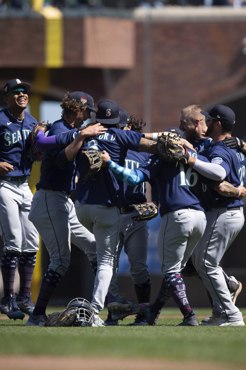 Seattle Mariners celebrate a victory over the San Francisco Giants in a baseball game Tuesday, July 4, 2023, in San Francisco. (AP Photo/D. Ross Cameron)