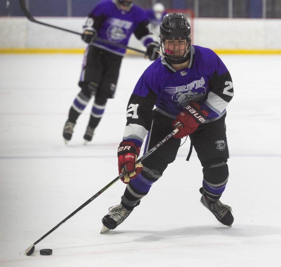 Rumson NikDoumas works in towards the goal. Rumson-Fair Haven Ice Hockey scrimmage against Wall in Wall, NJ on December 1, 2023.
