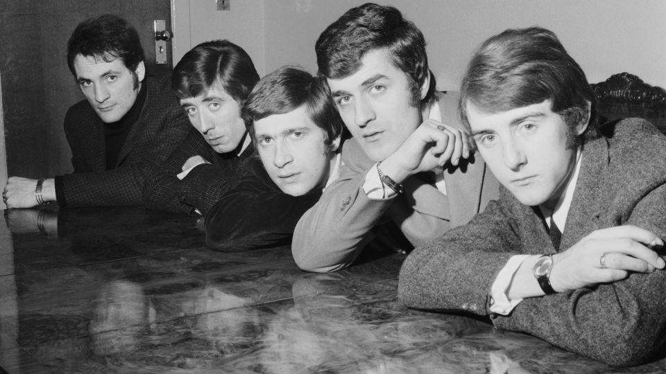 12th February 1965: British pop group, The Moody Blues at a meeting in their shared house in south London. Left to right : Mike Pinder, Clint Warwick, Graeme Edge, Ray Thomas and Denny Laine. - Chris Ware/Hulton Archive/Getty Images