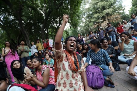 A student shouts slogans during a protest against the scrapping of the special constitutional status for Kashmir by the government, in New Delhi