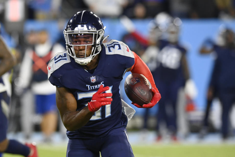 Tennessee Titans free safety Kevin Byard runs back an intercepted pass against the Buffalo Bills in the first half of an NFL football game Monday, Oct. 18, 2021, in Nashville, Tenn. (AP Photo/Mark Zaleski)